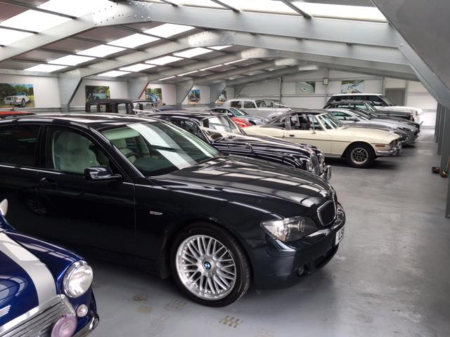 A row of old cars inside a building